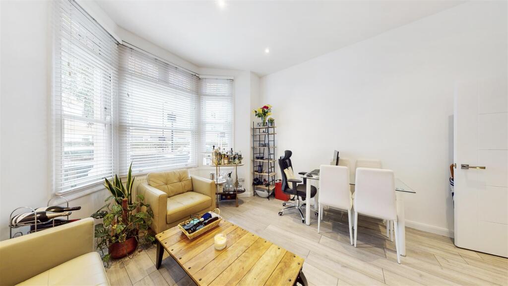 High ceilings in reception room into bay window