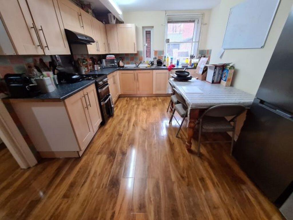 Bright and functional kitchen featuring ample w...