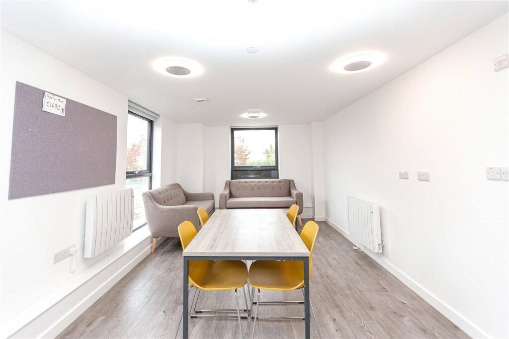 Bright and clean communal lounge featuring mode...