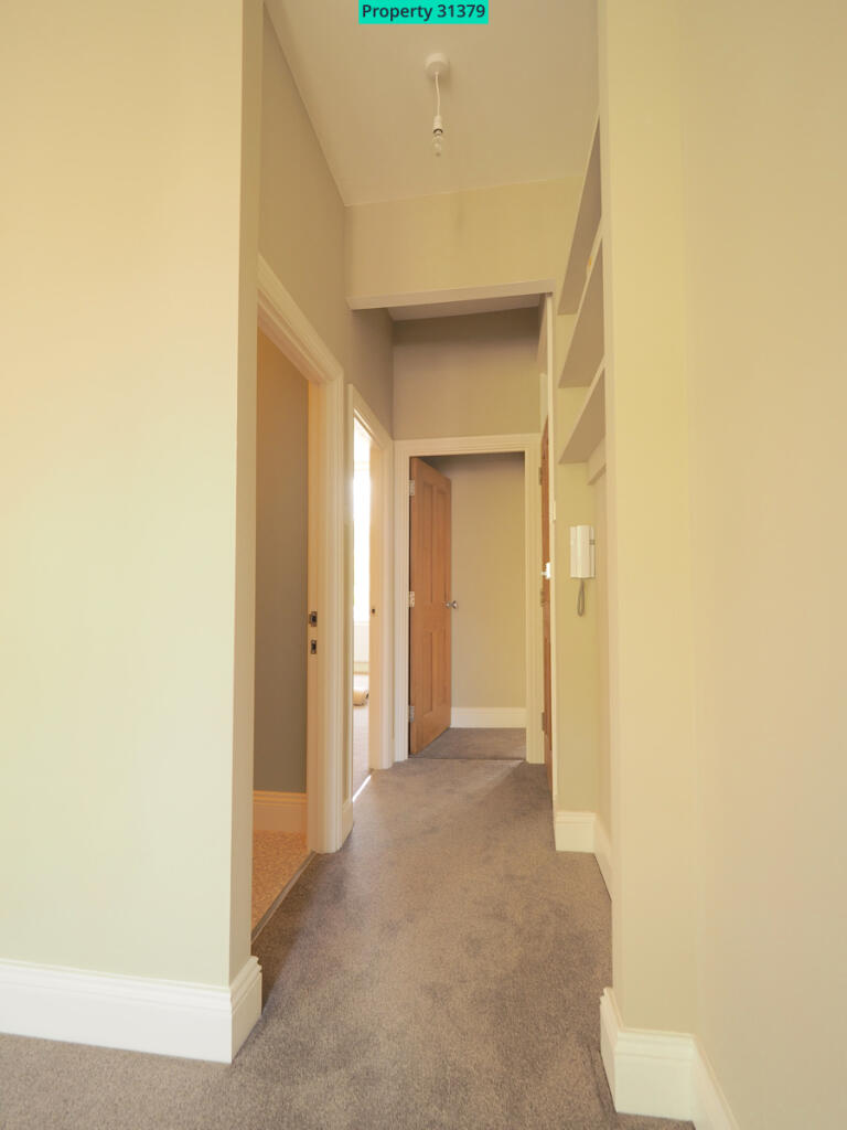 Hall from lounge with storage shelves