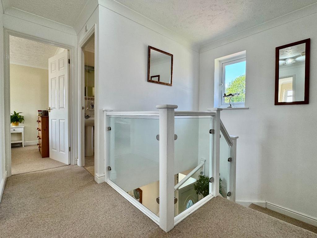 Sun filled landing to the 4 bedrooms