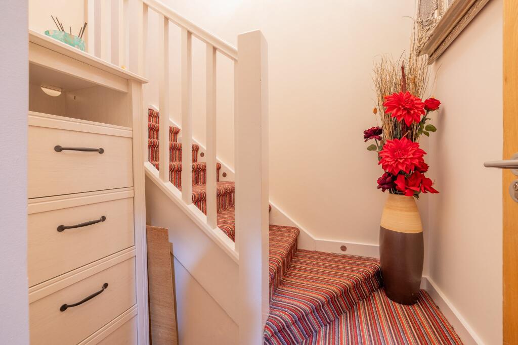 Stairs from the front apartment door to the landing