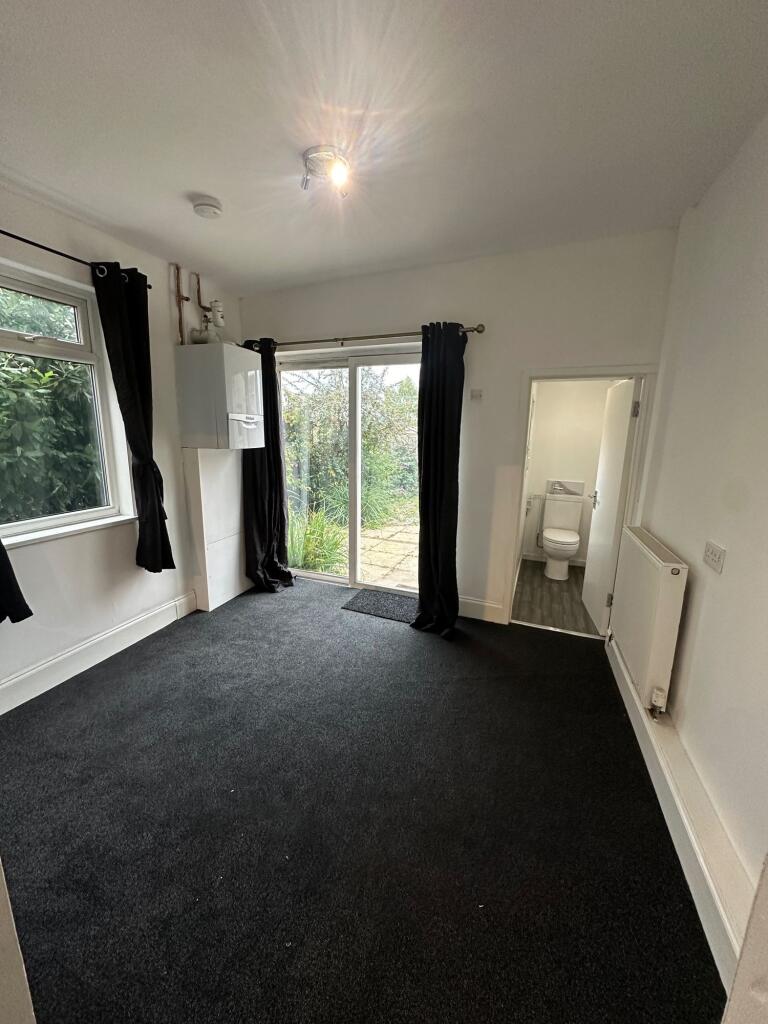 A neat and well-maintained small room featuring...