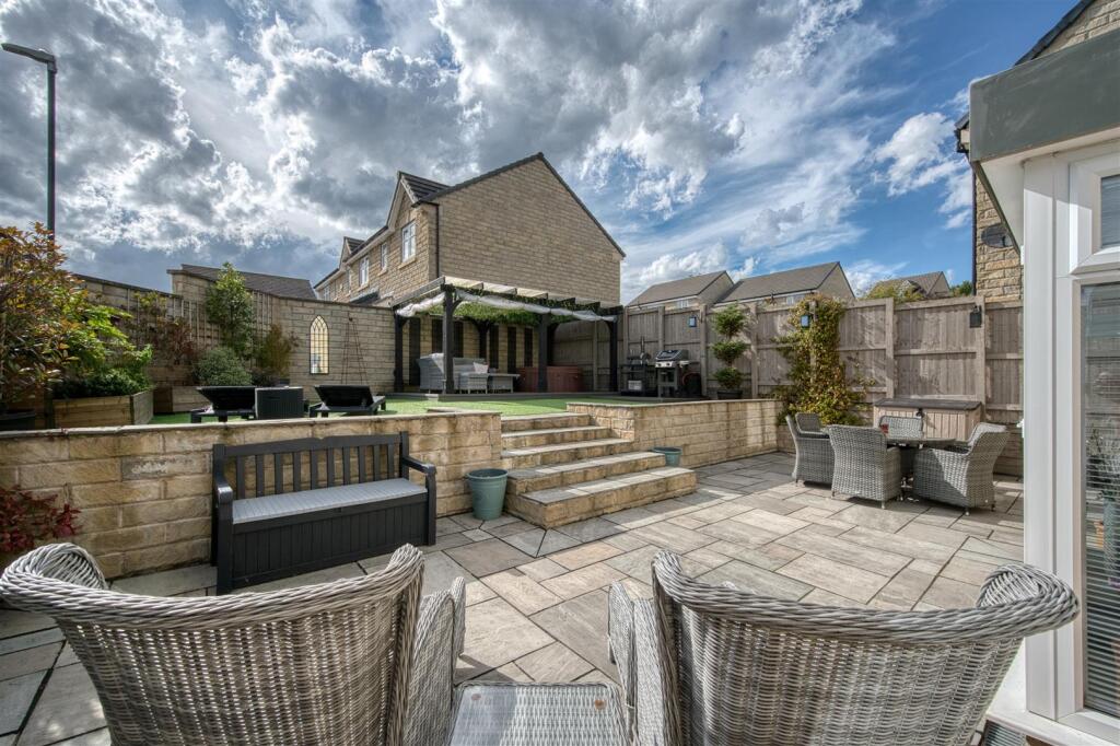 Rear Garden - dining patio and lawn.jpg