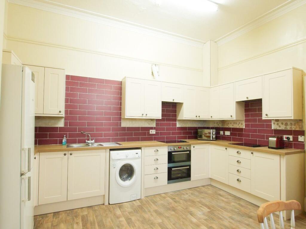 Spacious and well-maintained kitchen featuring ...
