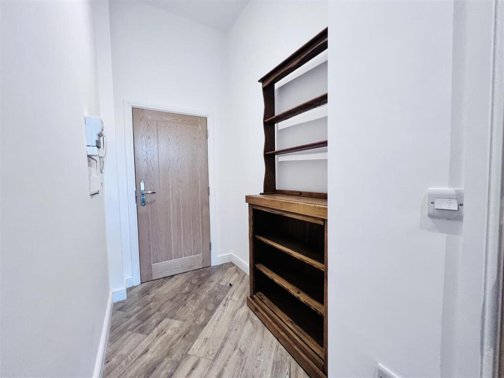 Entrance And Bookshelf