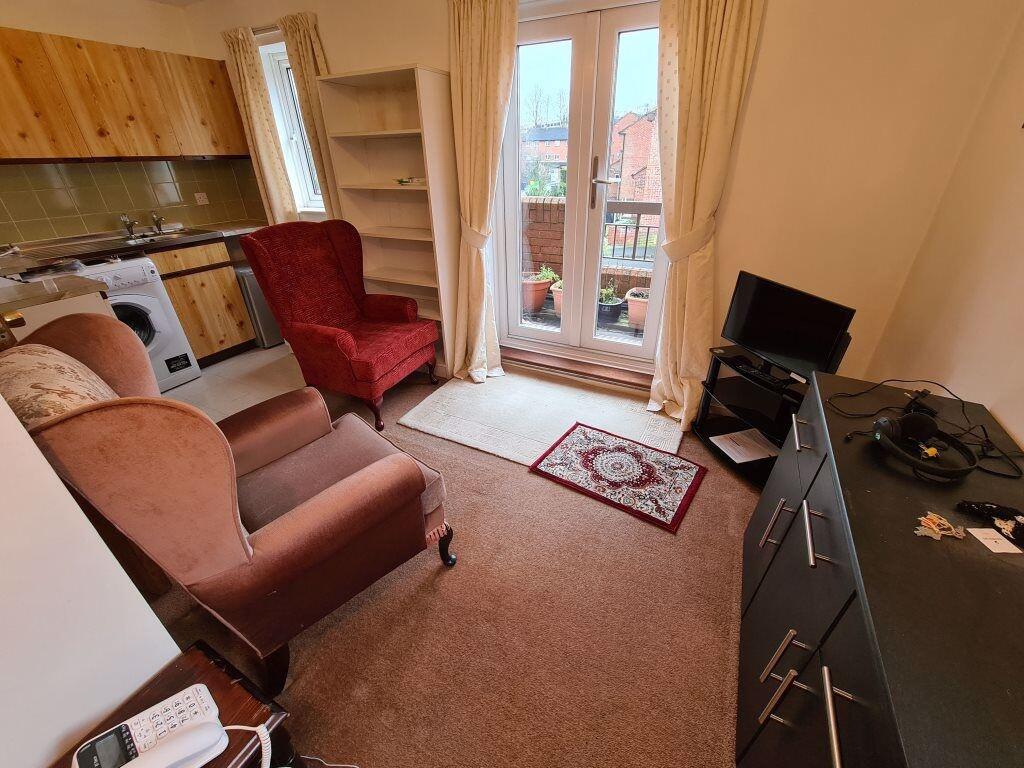 A cozy living room with comfortable armchairs a...