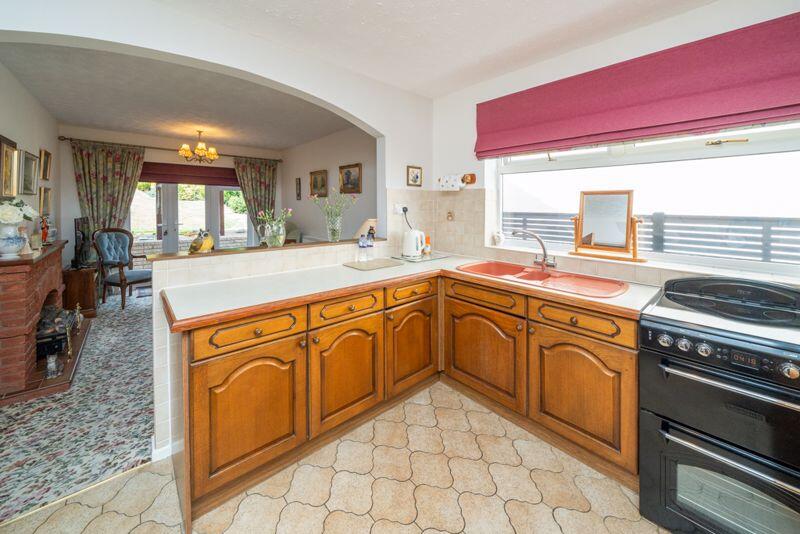 KITCHEN OPENS TO DINING ROOM