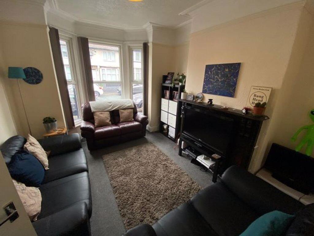 A cozy living room featuring comfortable sofas ...