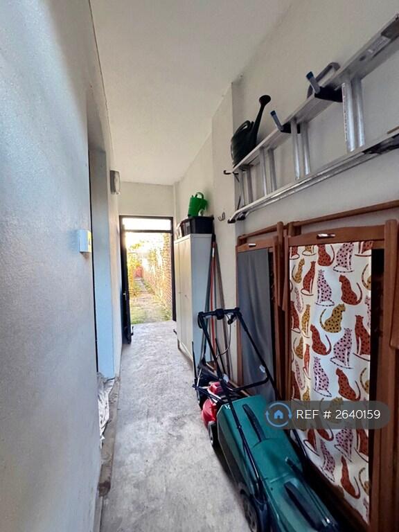 Path To Garden With Garden Tools And Lounge Chairs