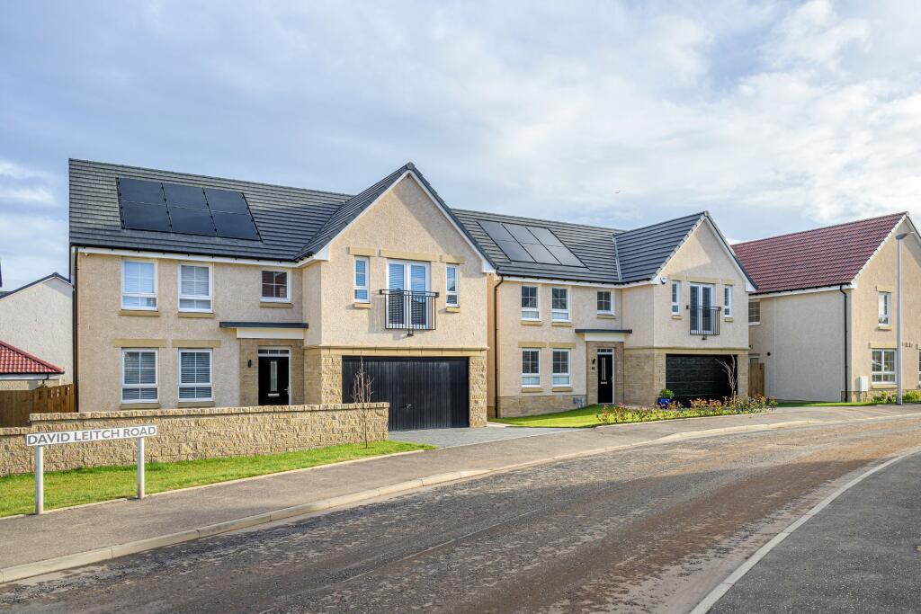 Street of detached 4 bed homes