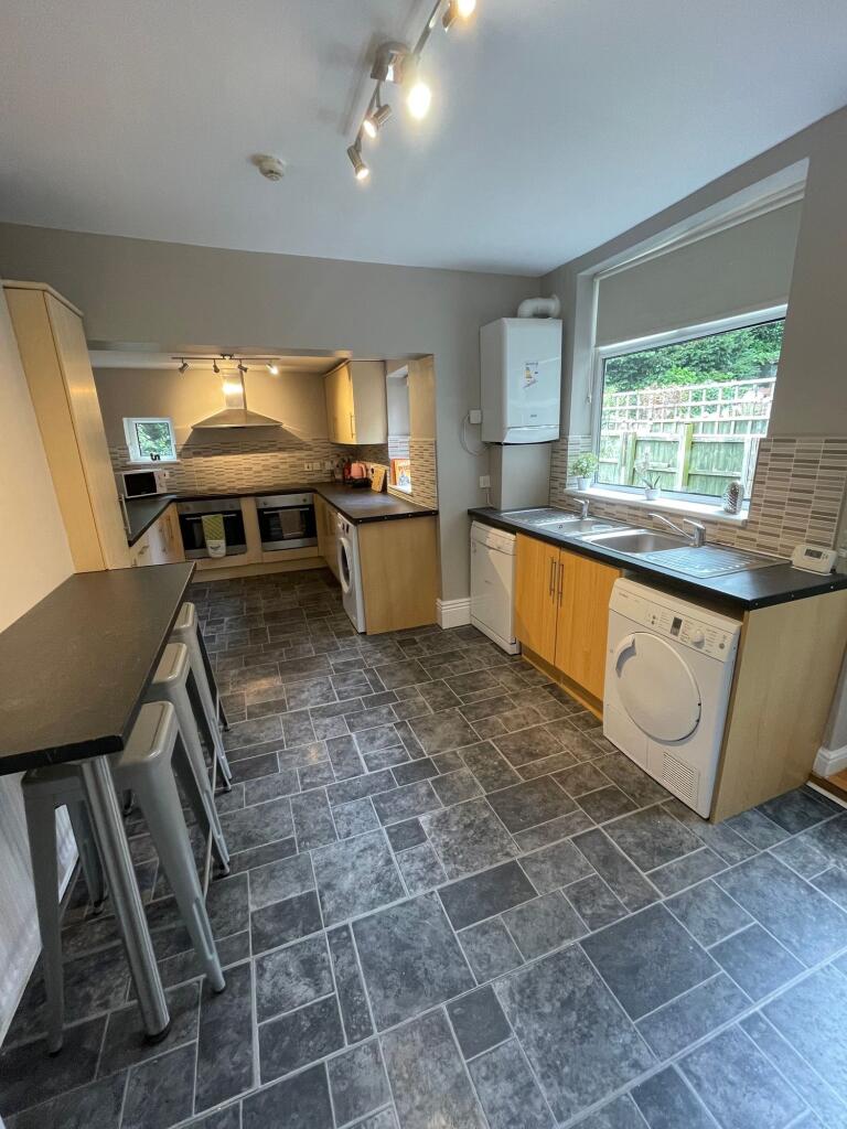 A bright and well-maintained kitchen featuring ...