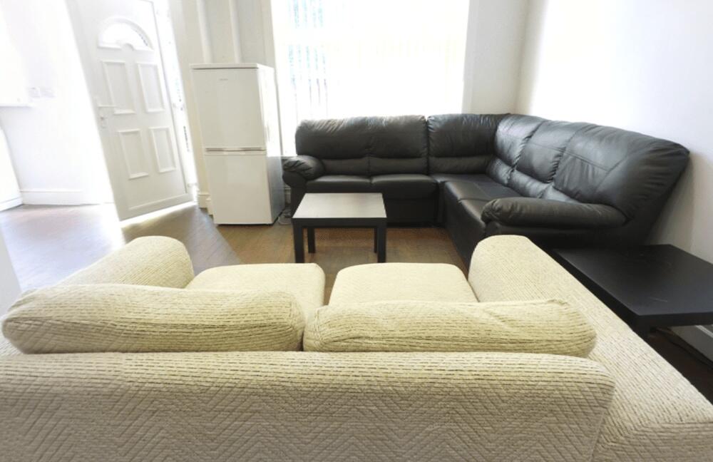 A modern and spacious living room featuring a c...