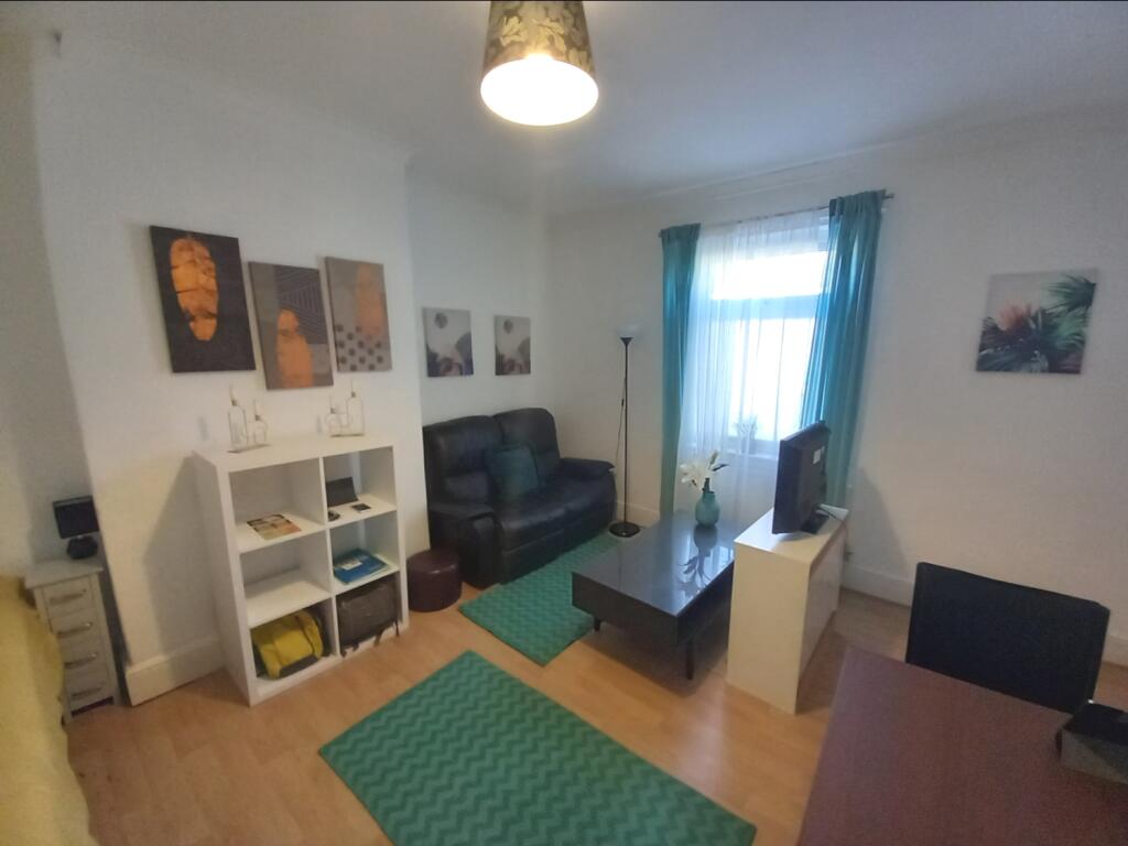 FIRST FLOOR APARTMENT LOUNGE AND BEDROOM