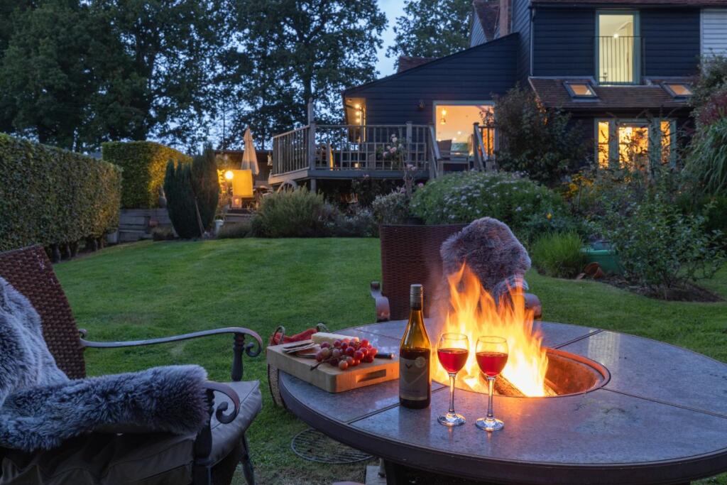 Twilight view of the garden and home