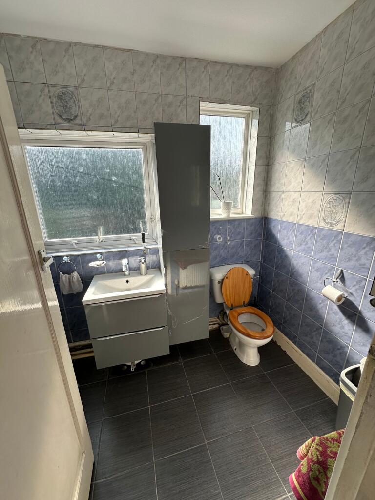 A clean and well-lit bathroom featuring a moder...