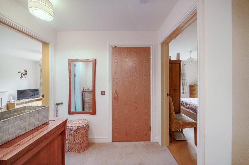 Entrance hall with storage cupboards
