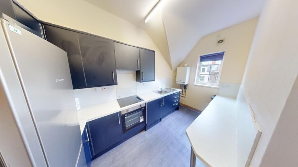 A modern and clean kitchenette featuring sleek ...