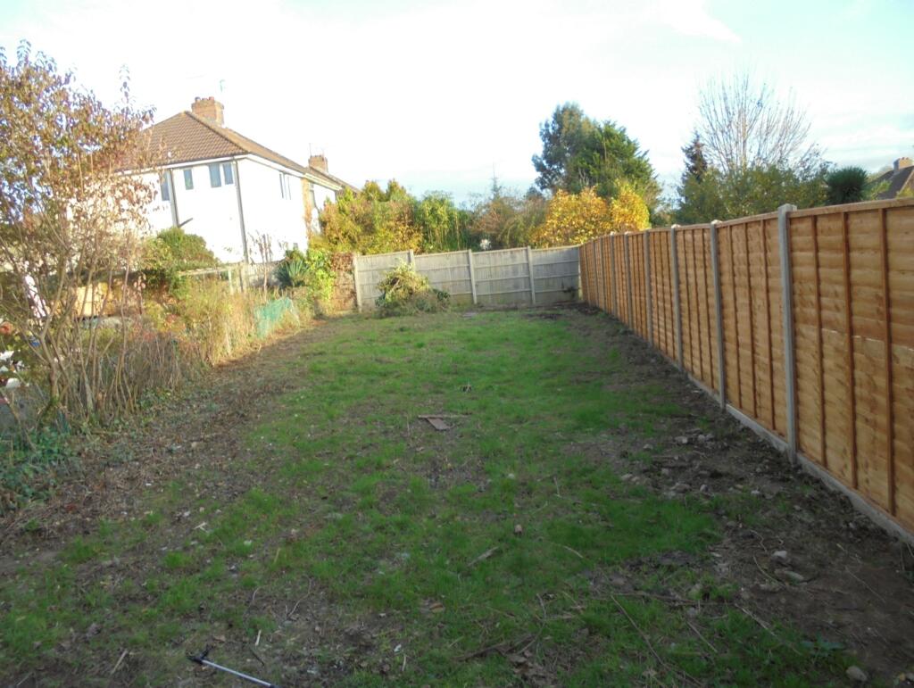 A spacious garden area with potential for relax...