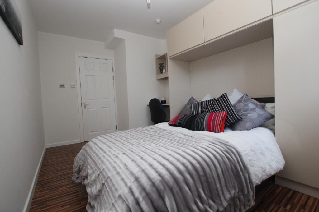 A spacious and well-maintained master bedroom f...