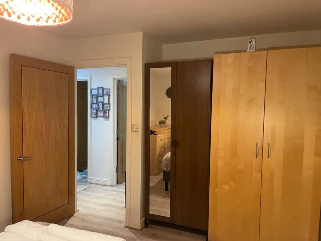A bright and tidy double bedroom featuring ampl...