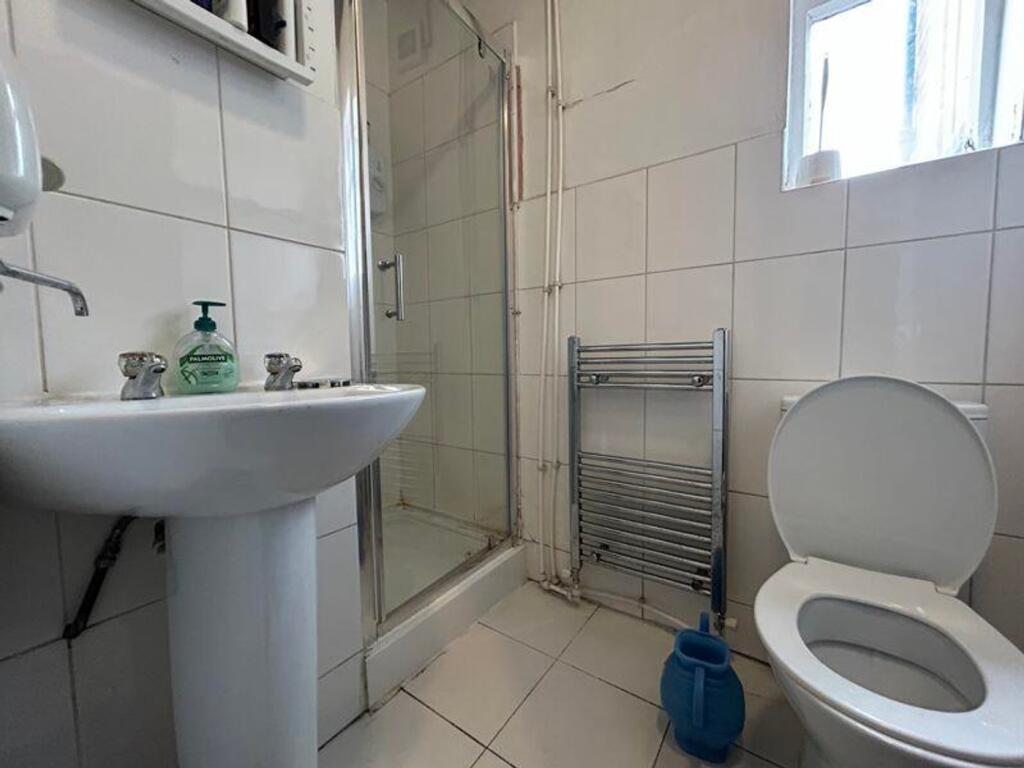 A clean and functional bathroom featuring moder...
