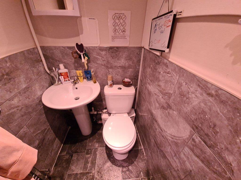 A modern bathroom featuring a clean pedestal si...