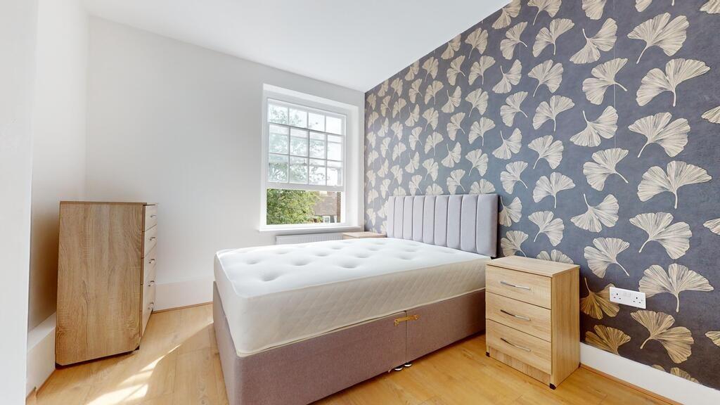 Bright and stylish double bedroom featuring a c...