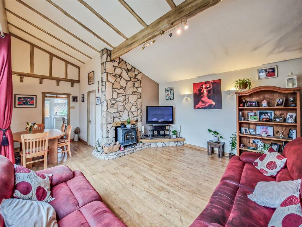 living-dining room with vaulted ceiling