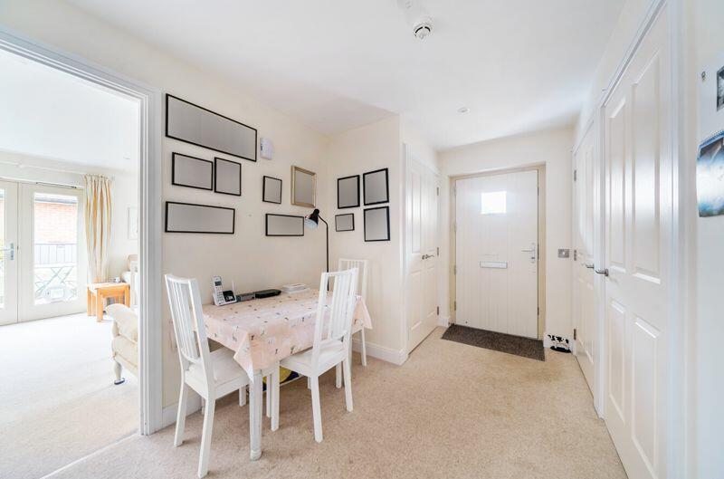 Hallway with storage cupboards