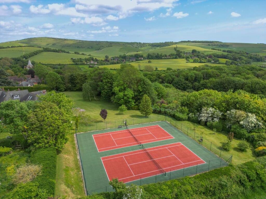 Drone view of the tennis courts, communal gardens 