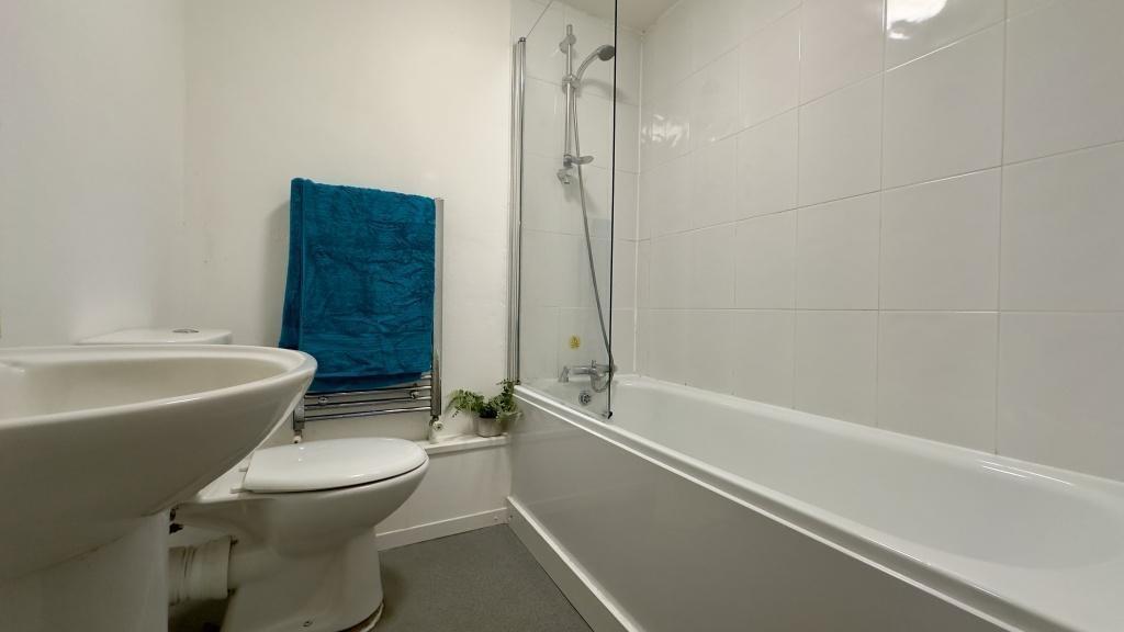 A clean and functional bathroom featuring a bat...