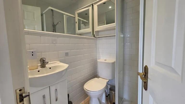 A clean and well-maintained bathroom featuring ...