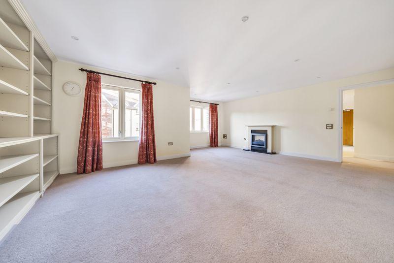 Living/dining room with built-in book...