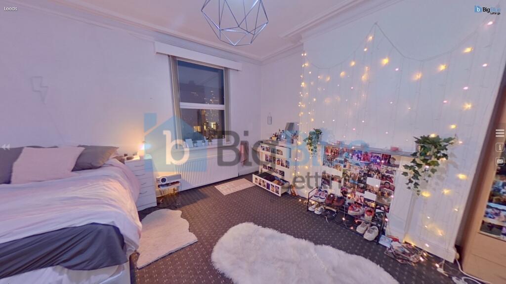 A cozy and inviting master bedroom with a doubl...