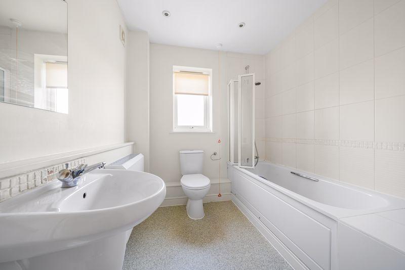 Bathroom with over-bath shower
