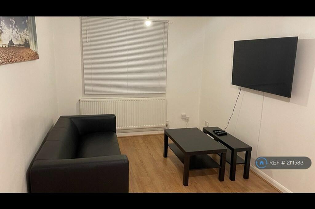 A modern and tidy living room featuring a styli...