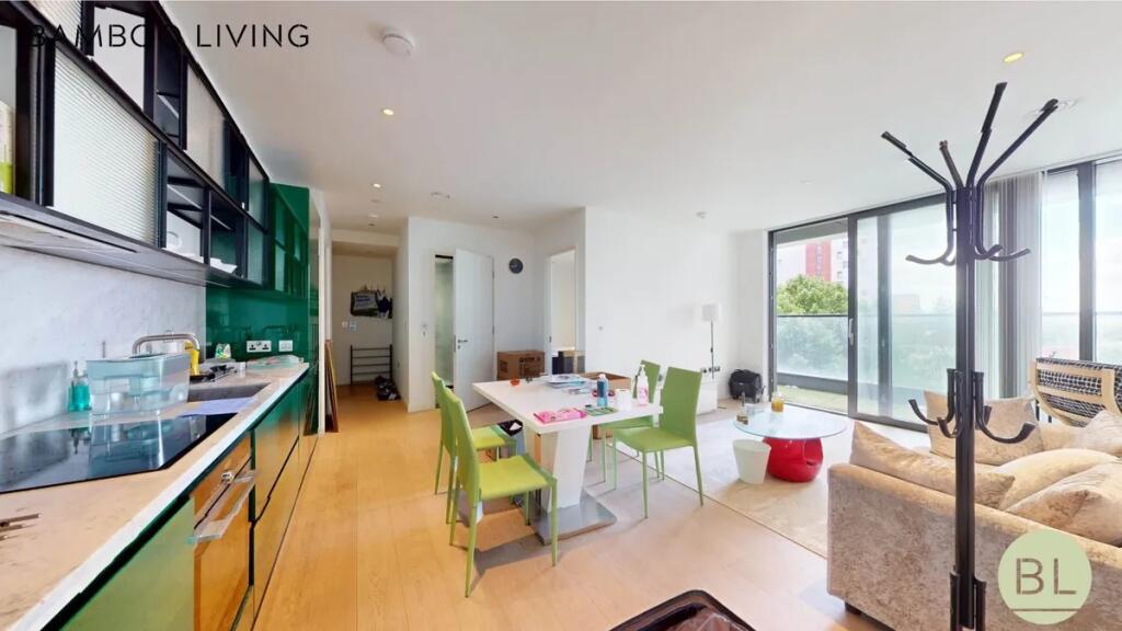 Bright and modern living room with an open-plan...