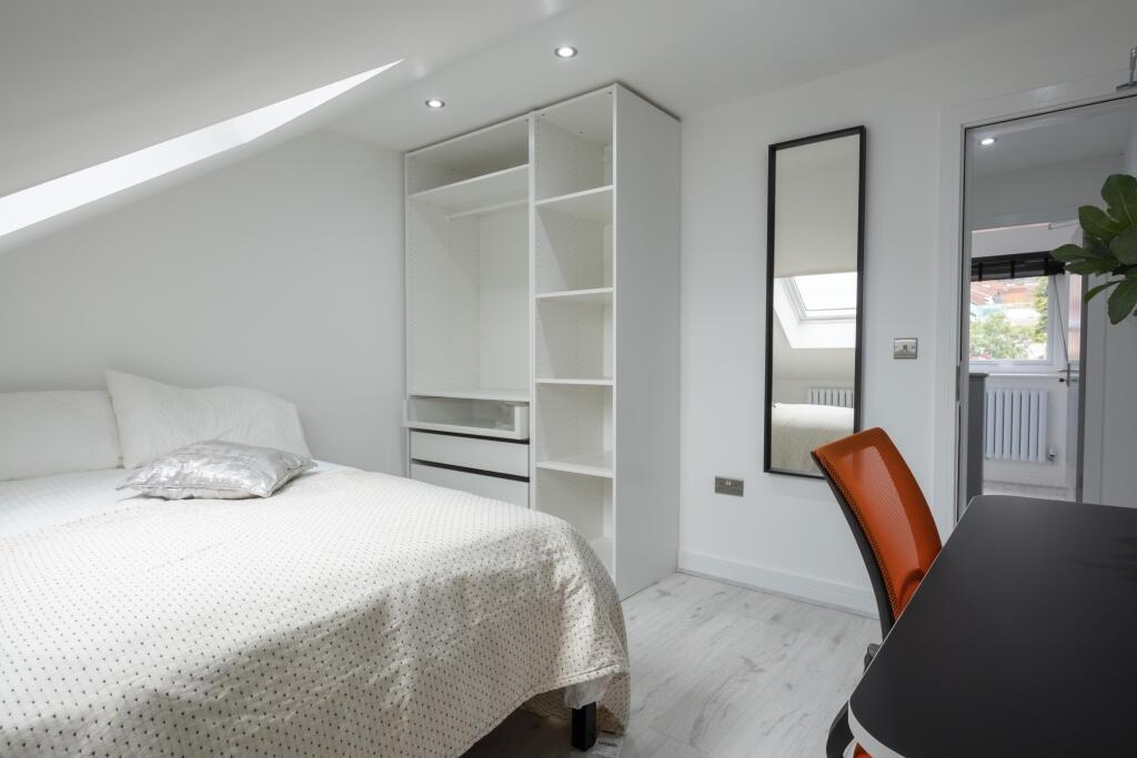 Bright and inviting double bedroom featuring a ...