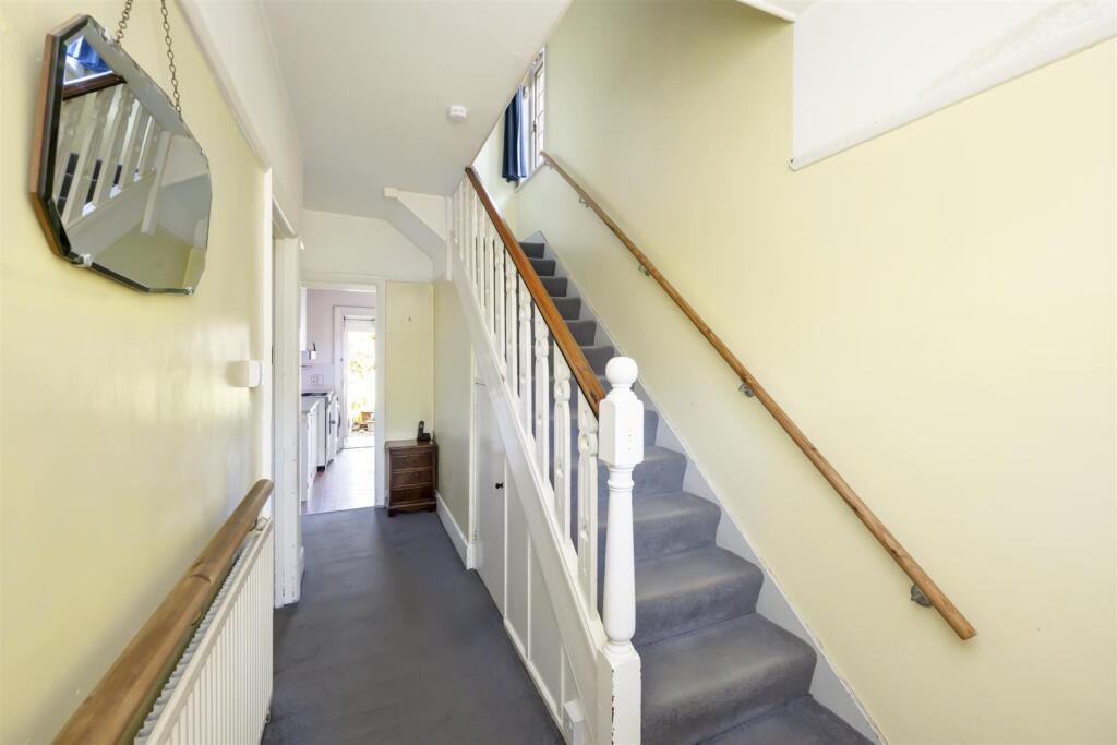 Stairs rising to First Floor