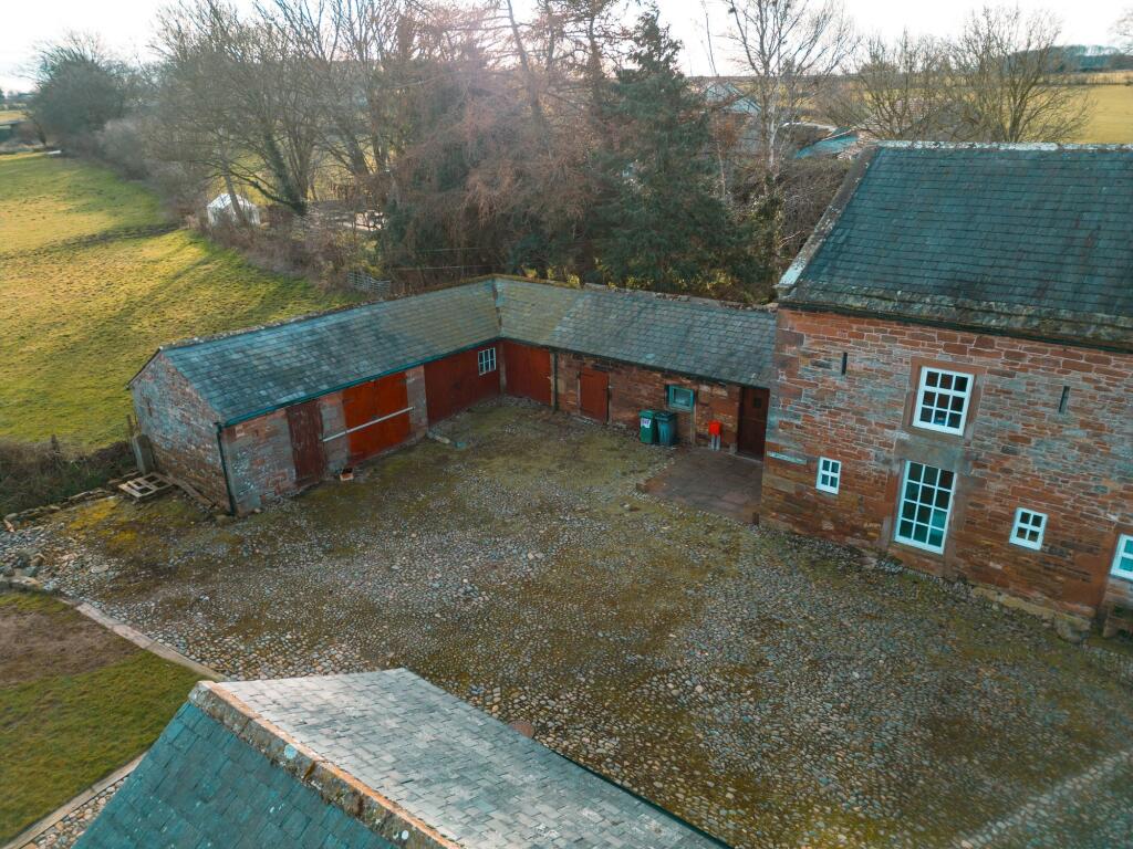 Cobbled Courtyard with access into Orchard Cottage and 4 outbuildings
