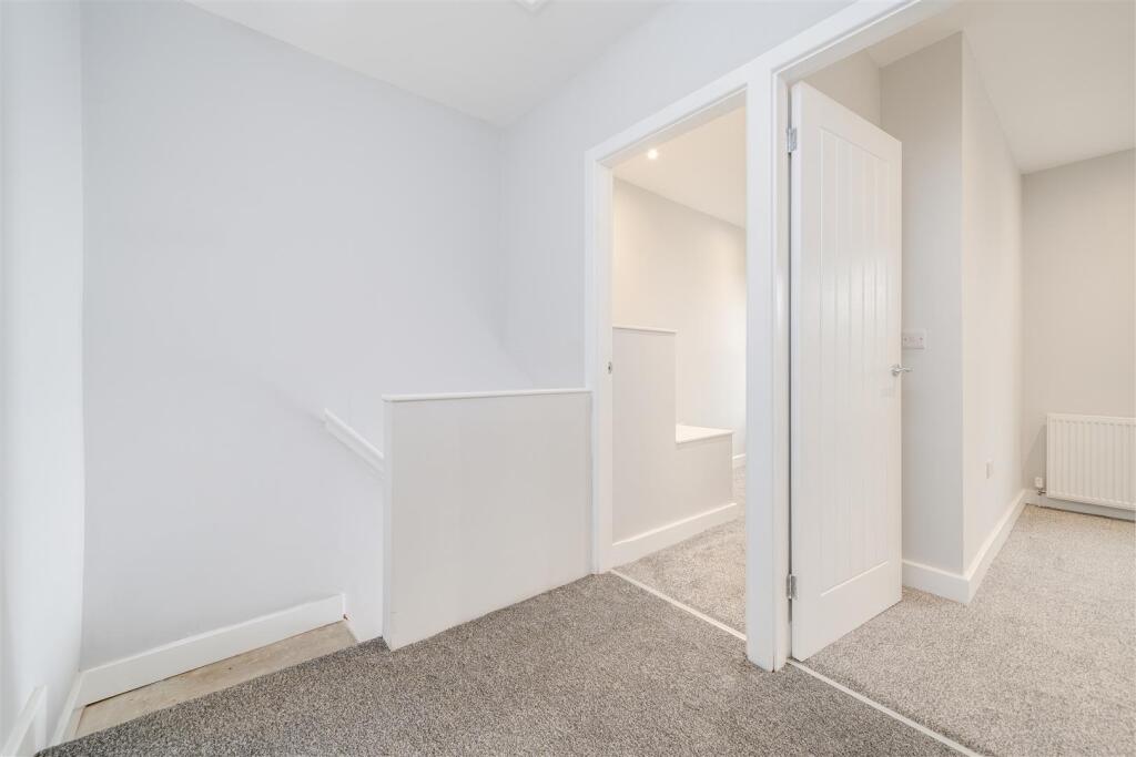 TO THE FIRST FLOOR LANDING