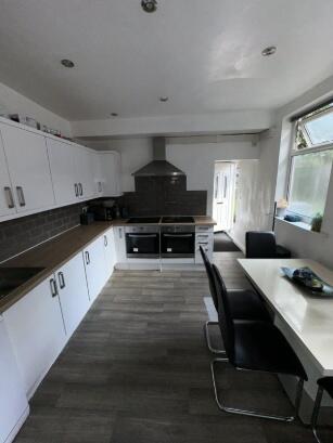 Bright and modern kitchen featuring ample count...