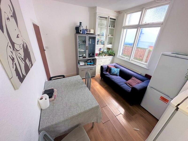 Bright and inviting living space featuring larg...