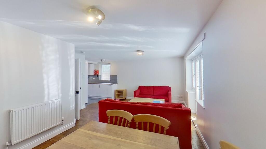 Bright open-plan living area with comfortable r...