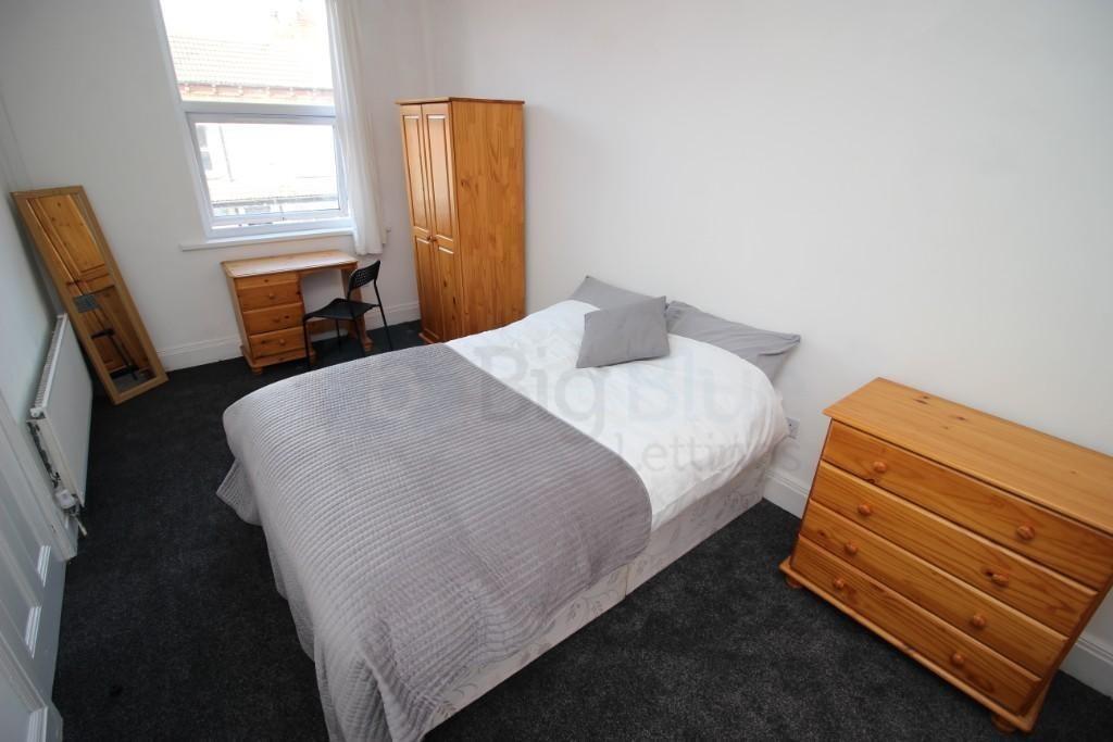 Bright and cozy double bedroom featuring a comf...