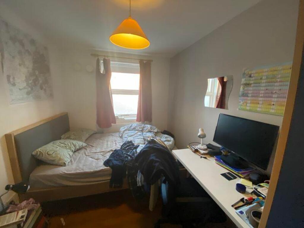 A cozy double bedroom with natural light, perfe...