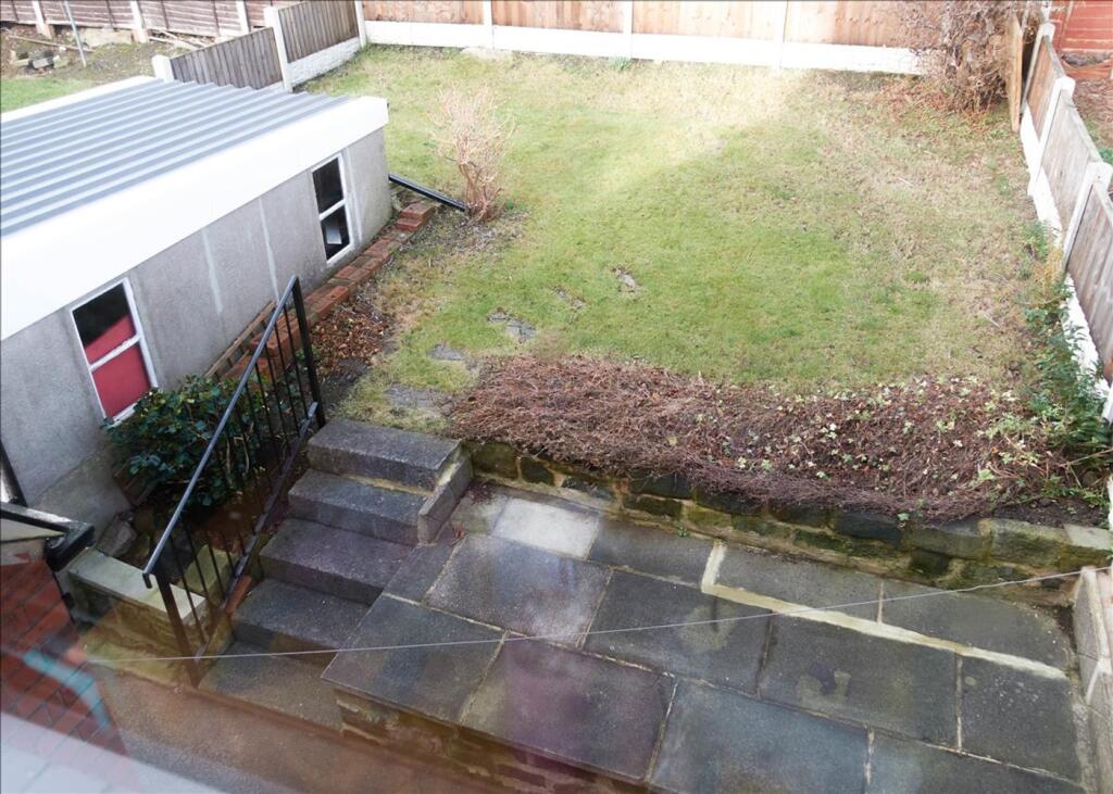 A charming garden area featuring a well-maintai...