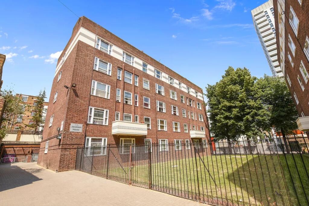 A well-maintained brick residential building wi...