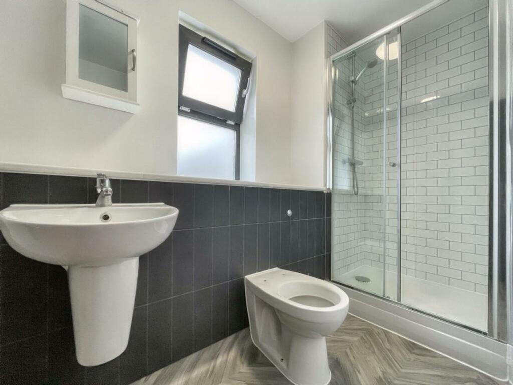 A modern and clean bathroom featuring a stylish...